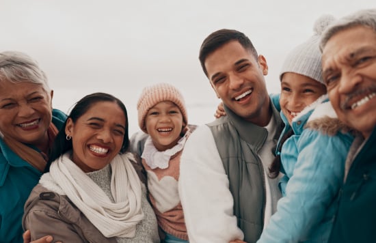 Happy hispanic family in the winter