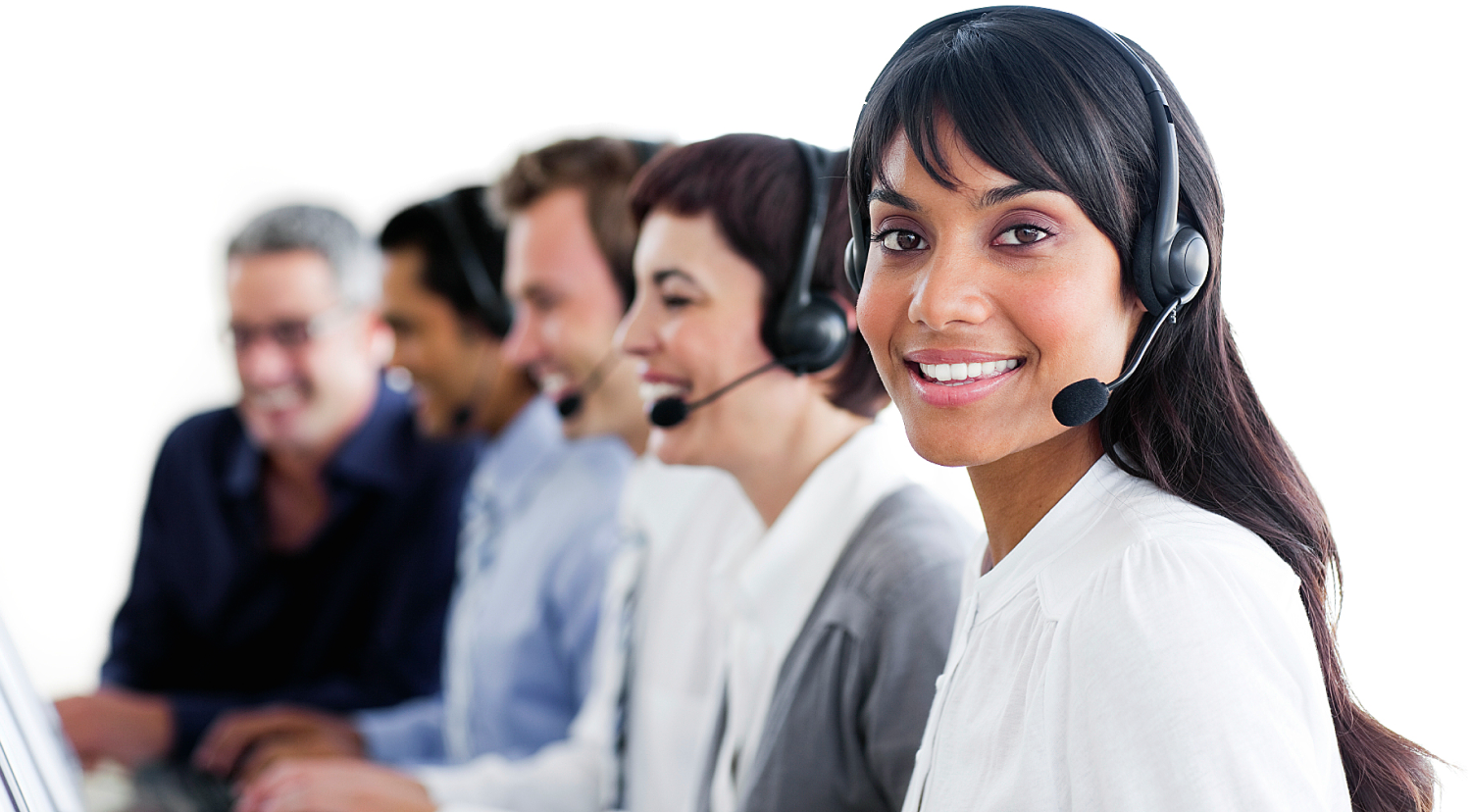 a row of customer service representatives with headsets. In the front is a femaie person of color